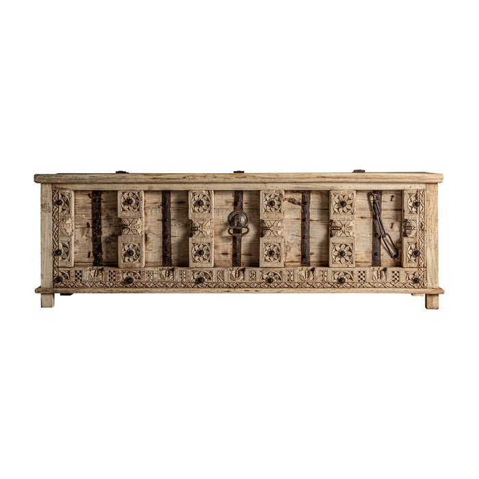 Introducing the exquisite handcrafted TV Stand PHALODI, a stunning piece of natural furniture perfect for any home. The unique ethnic style and natural distressed color create a warm and inviting ambiance, while the use of high-quality mango wood adds durability and longevity to the piece