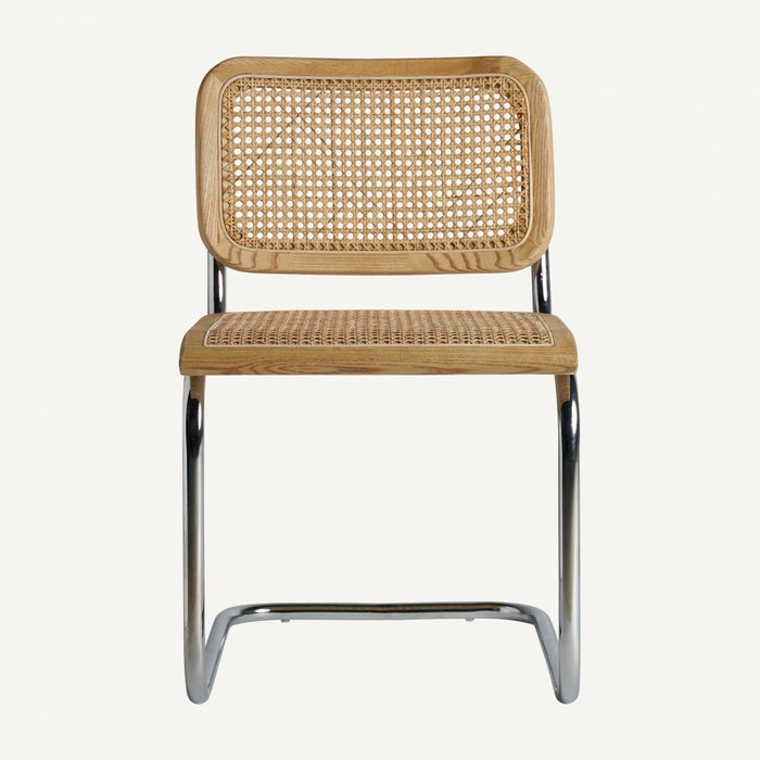 The SINS chair is a statement piece that effortlessly combines contemporary style with natural charm. Made of high-quality elm wood, rattan, and steel, this chair boasts a sleek and modern design that is both durable and visually appealing