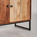 This Nordic-style bar cabinet, BROWN &amp; BEIGE, is made of recycled mango wood, wrought iron, and cowhide leather. Its unique design adds warmth and natural charm to any living space.