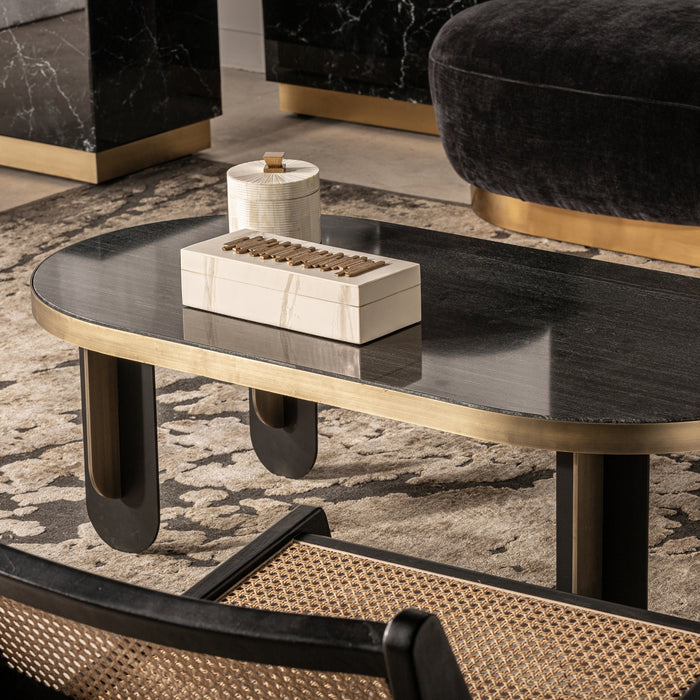 The Bayreuth Coffee Table is a stunning example of Art Deco design, featuring a captivating Black & Gold color scheme that adds a touch of opulence to any space. It is skillfully crafted with a combination of premium materials, including exquisite marble and sturdy iron