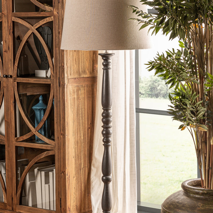 exquisite black Floor Lamp Teucrium. This Provenzal-style lamp features a sleek black color that effortlessly complements any interior decor. Crafted from premium mango wood, it showcases the beauty of natural materials and offers durability