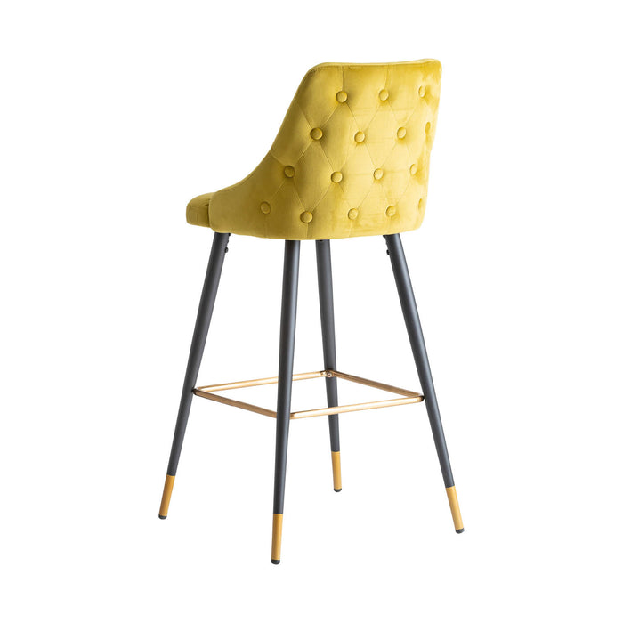 The Carpi Stool is a stunning piece that embodies a Kitsh Style with its Mustard and Black color scheme. Made with exquisite Velvet upholstery, it combines the durability of MDF and Iron for a sturdy construction