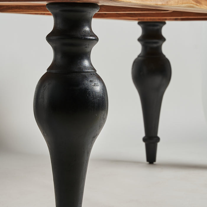 Transform your dining experience with the luxurious Zenica Dining Table. Crafted in a Provenzal style with black and natural acacia wood, this table is both elegant and sturdy