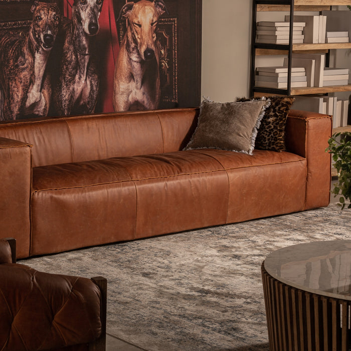 Kurza collection sofa and armchair are two pieces notable for their simplicity, but they are eye-catching at the same time; wherever you place them, they add personality to your room. They are made of cowhide, along with fir tree wood and foam, and the chocolate brown color is the hallmark of this collection
