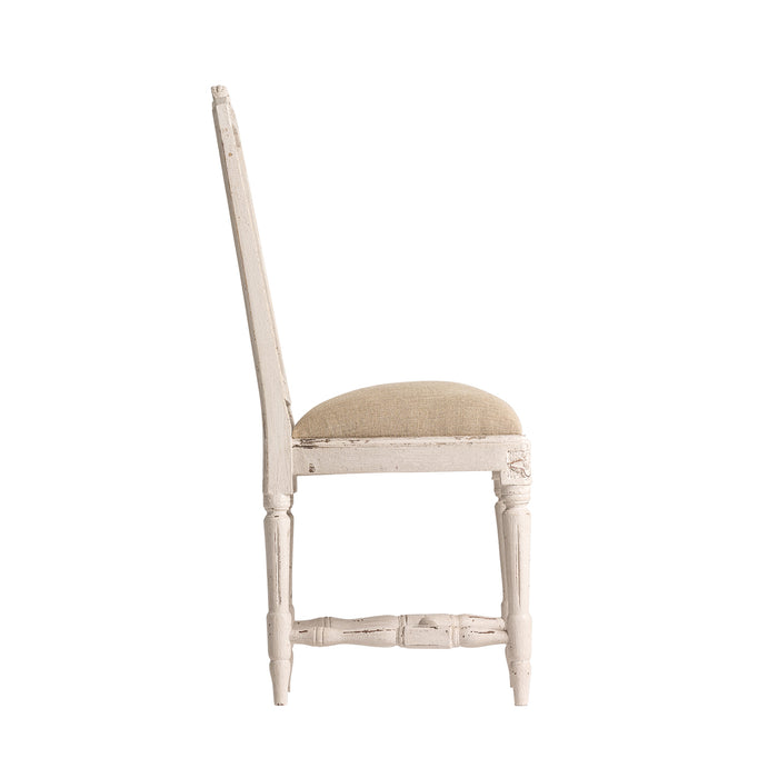 Chair Dollot, in a tranquil beige hue, encapsulates the rustic charm of Provenzal design. Crafted from authentic mango wood and upholstered in a blend of soft cotton and linen, it offers a harmonious marriage of texture and comfort