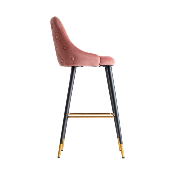 The Carpi Stool is a stunning piece that embodies a Kitsh Style with its Pale Pink color scheme. Made with exquisite Velvet upholstery, it combines the durability of MDF and Iron for a sturdy construction