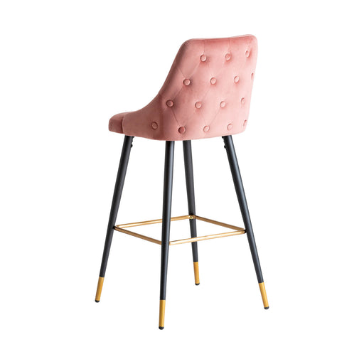 The Carpi Stool is a stunning piece that embodies a Kitsh Style with its Pale Pink color scheme. Made with exquisite Velvet upholstery, it combines the durability of MDF and Iron for a sturdy construction