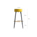 Carpi Stool, in contrasting mustard and black hues, takes a playful nod to the quirky Kitsh aesthetic. It's artfully upholstered in rich velvet, set atop a robust foundation of MDF and iron. Beyond its style, it's thoughtfully constructed to be easily disassembled, adding to its practical appea