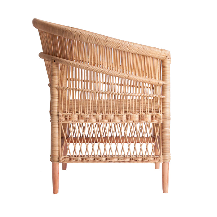 Elegant armchair in natural color, made from a combination of rattan, mindi wood, and cotton