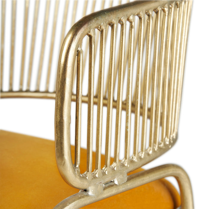 Experience luxurious comfort and elegant style with the Zug Chair in stunning Oro color. This Art Deco-inspired chair features a sturdy iron frame that provides stability and durability