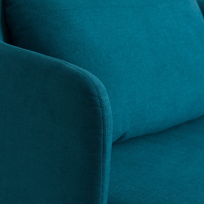 Experience retro-inspired comfort and style with the Dimaro Armchair. Its vibrant blue color adds a playful touch to any room, while the unique kitsh style captures the essence of vintage aesthetics