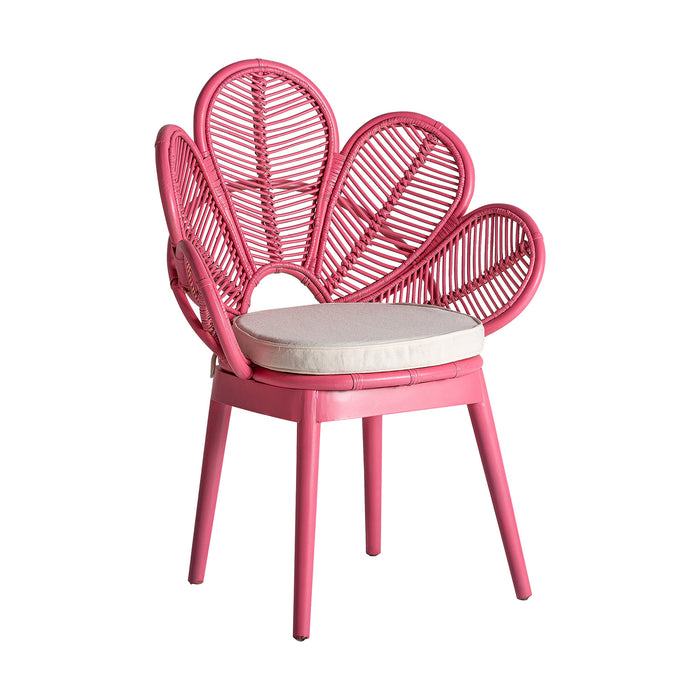 The Lluc armchair, in a playful pink hue, is a radiant embodiment of the kitsch style. Fashioned from rattan and complemented with soft cotton and foam, it offers both comfort and aesthetic appeal. With its removable feature and striking design, this armchair is not just a functional piece but also a bold statement in any decor setting.