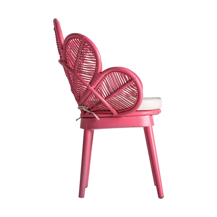 The Lluc armchair, in a playful pink hue, is a radiant embodiment of the kitsch style. Fashioned from rattan and complemented with soft cotton and foam, it offers both comfort and aesthetic appeal. With its removable feature and striking design, this armchair is not just a functional piece but also a bold statement in any decor setting.