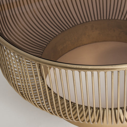 Introducing the luxurious Coffee Table Round ZUG, a stunning piece that will elevate any living space. The table features an elegant Art Deco design in a striking gold color, and is expertly crafted from high-quality iron and crystal