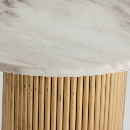 contemporary living space with the stylish "Coen" Side Table. Its sleek design in a striking white & gold color combination adds a touch of modern elegance to any room. Crafted with a sturdy steel frame, this side table ensures durability and stability. The table top features synthetic marble, which not only showcases a luxurious appearance but also offers easy maintenance