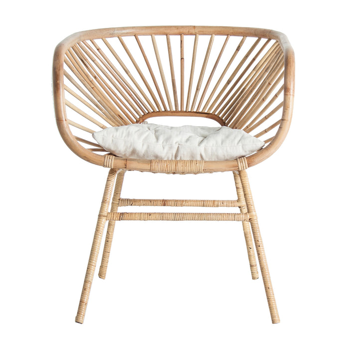The Ruda armchair, in a soothing natural color, embodies the minimalist beauty of contemporary design. Expertly crafted from organic rattan and paired with plush cotton, it offers a harmonious blend of texture and comfort