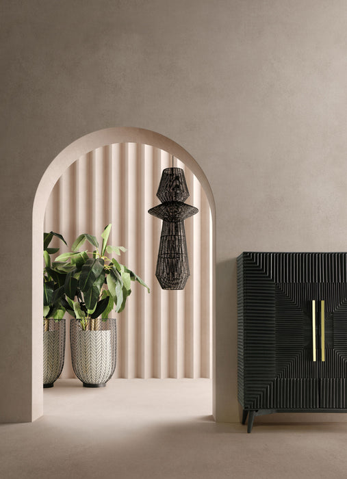 The Plissé Wood Wardrobe in sleek black color is a stunning example of Art Deco style. Crafted from high-quality mango wood and complemented with iron accents, it showcases a perfect blend of elegance and durability. 