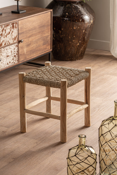 Experience the infusion of nature and luxury with our STOOL MANHULA. Crafted from premium teak wood and natural fiber, this colonial-style stool boasts a natural color and exquisite design. Suitable for both indoor and outdoor use, it's the perfect addition to your elegant and exclusive decor.