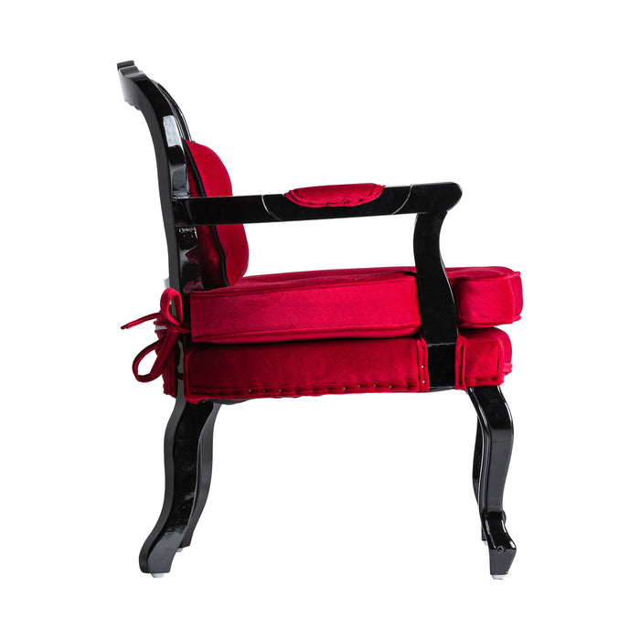 The Laleu armchair boasts a vibrant red hue, exuding the timeless elegance of colonial style. Crafted from luxurious velvet and complemented with sturdy pine wood, this product is designed for both aesthetic appeal and durability