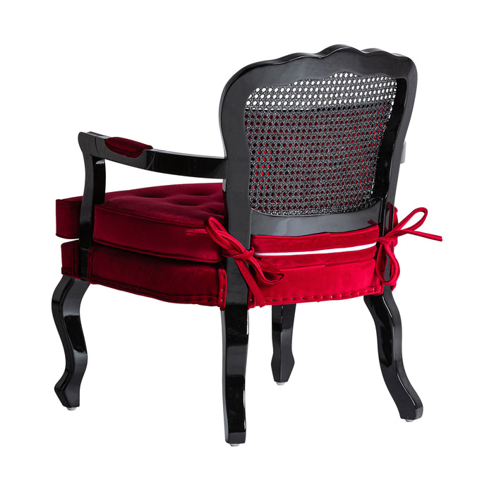 The Laleu armchair boasts a vibrant red hue, exuding the timeless elegance of colonial style. Crafted from luxurious velvet and complemented with sturdy pine wood, this product is designed for both aesthetic appeal and durability