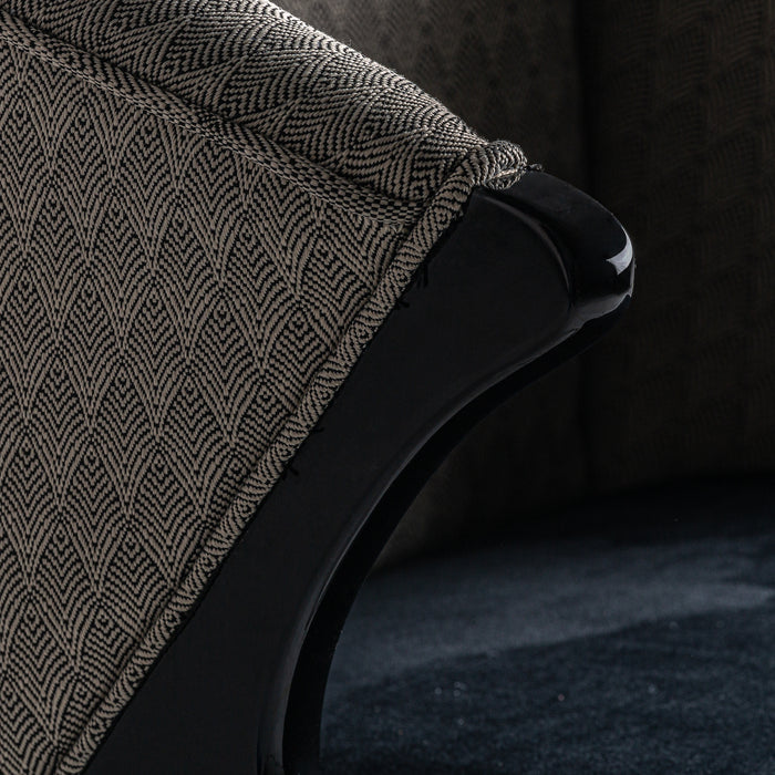 The Trun Armchair is a luxurious statement piece that blends plush velvet with pine wood to create a stunning piece of furniture. Its black and gold color scheme and art deco style exude opulence, making it a standout addition to any living space