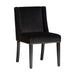 The Plaue chair, in a deep black shade, radiates the timeless sophistication of classic design. Constructed from resilient pine wood and enveloped in plush velvet with a cushioned foam layer, it ensures an opulent seating experience.