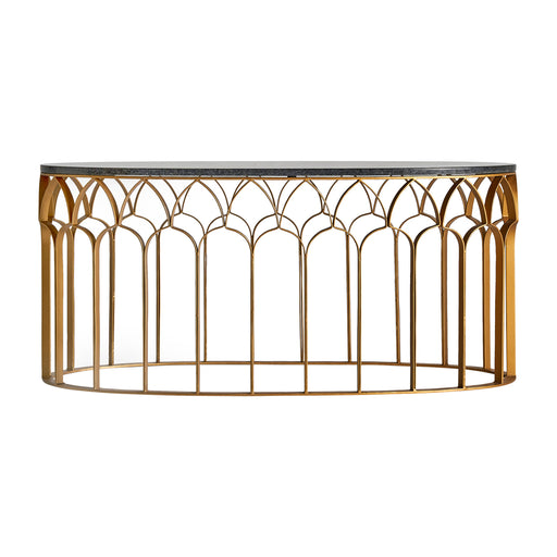 The luxurious Lauw coffee table is an Art Deco masterpiece, with an oval shape and a gold finish that exudes elegance. It is expertly crafted from iron and marble, making it a true statement piece in any room