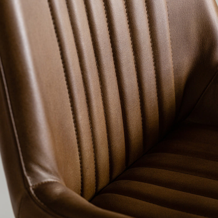Embrace vintage charm and comfort with the Morton Chair in a timeless Camel color. Crafted with a combination of luxurious leather, durable iron, and supportive foam, this chair offers both style and functionality