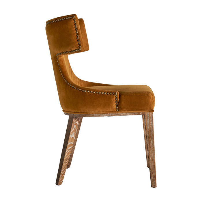 Indulge in the vintage allure of the Dozza Chair, featuring a warm ochre color that adds a touch of elegance to any space. This chair is meticulously crafted with a combination of premium fabric upholstery, sturdy birch wood, and plush foam padding, ensuring both comfort and durability