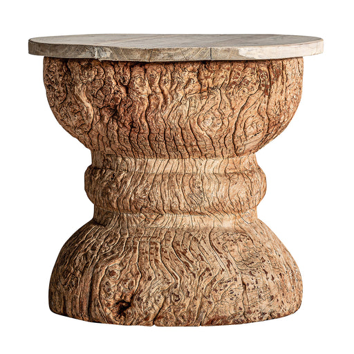 The Assorted Besakoa Side Table showcases a captivating Ethnic Style in a Natural Distressed color. Crafted from high-quality Teak Wood, it features a unique combination with Mango Wood, making each piece truly one-of-a-kind