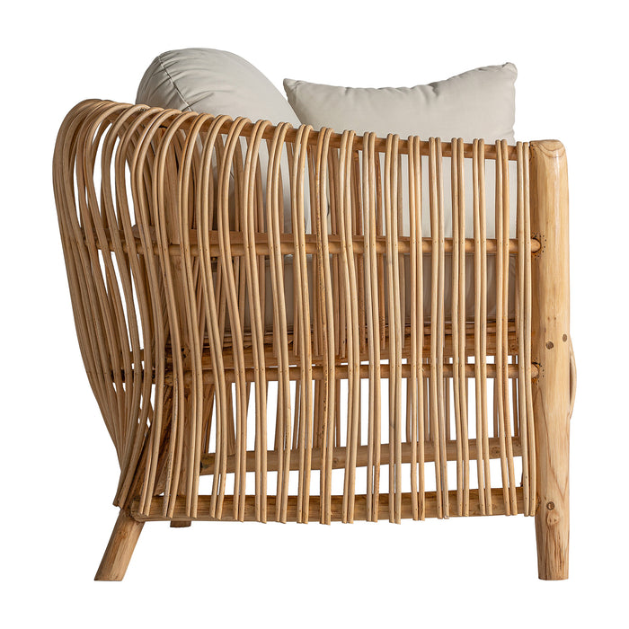 Armchair Tisno, in its understated natural shade, embodies the sophistication of contemporary design. Masterfully crafted from rattan and paired with soft cotton, it serves as a testament to both aesthetic allure and comfort