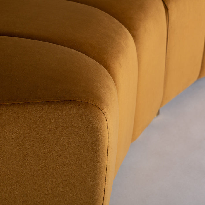 Indulge in the luxurious comfort of the Suhl Modular Sofa, a masterpiece of Art Deco design. Its striking Mustard color instantly adds warmth and vibrancy to any space. Meticulously crafted, this sofa features a plush velvet upholstery that invites you to sink in and relax