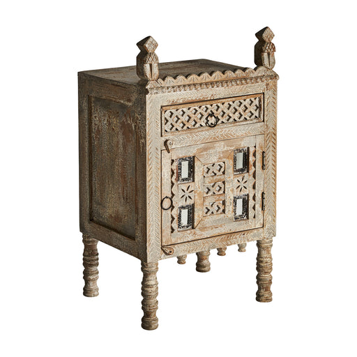 The Chaiyi Bedside Table is a stunning piece of wooden furniture, beautifully hand-carved from mango wood. Its cream color and oriental style add a touch of elegance to any bedroom