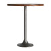 Tyler Bar Table, exuding a muted grey juxtaposed with natural undertones, is a nod to the timeless allure of vintage aesthetics. Crafted from durable iron, its structure is perfectly balanced by the rich warmth of mango wood, bringing forth a piece that seamlessly marries industrial strength with old-world charm