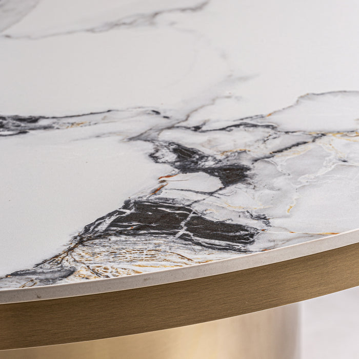 Introducing the luxurious Dining Table Astach, designed in stunning white and gold with an elegant Art Deco style. Crafted with high quality porcelain tile and sturdy steel, this dining table will elevate any dining experience. Immerse yourself in sophistication with Astach