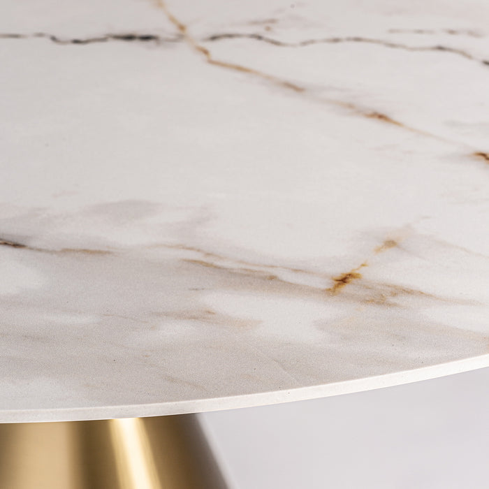 Elevate your dining experience with the Freyung Dining Table, a stunning Art Deco masterpiece. The combination of White & Gold colors exudes a sense of luxury and refinement. Crafted with precision from steel and porcelain tile, this table showcases a perfect blend of durability and elegance.
