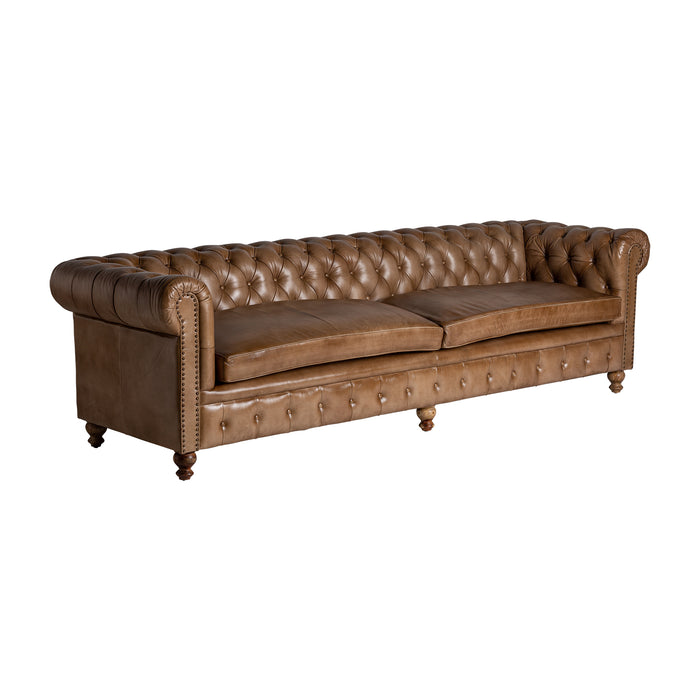 Buttoned leather sofa ELKINS, adorned in a rich brown hue, exudes the nostalgic allure of vintage design. Skillfully crafted from luxurious leather and complemented with sturdy pine wood, it combines classic aesthetics with durability