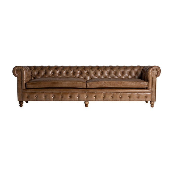 Buttoned leather sofa ELKINS, adorned in a rich brown hue, exudes the nostalgic allure of vintage design. Skillfully crafted from luxurious leather and complemented with sturdy pine wood, it combines classic aesthetics with durability