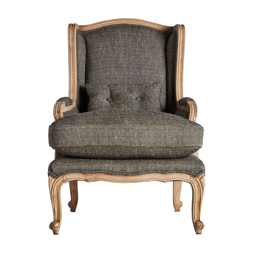 The Ruoms armchair, presented in muted grey and natural tones, showcases the enduring allure of colonial style. Crafted meticulously from mango wood and seamlessly paired with resilient polyester, it stands as a harmonious blend of form and function