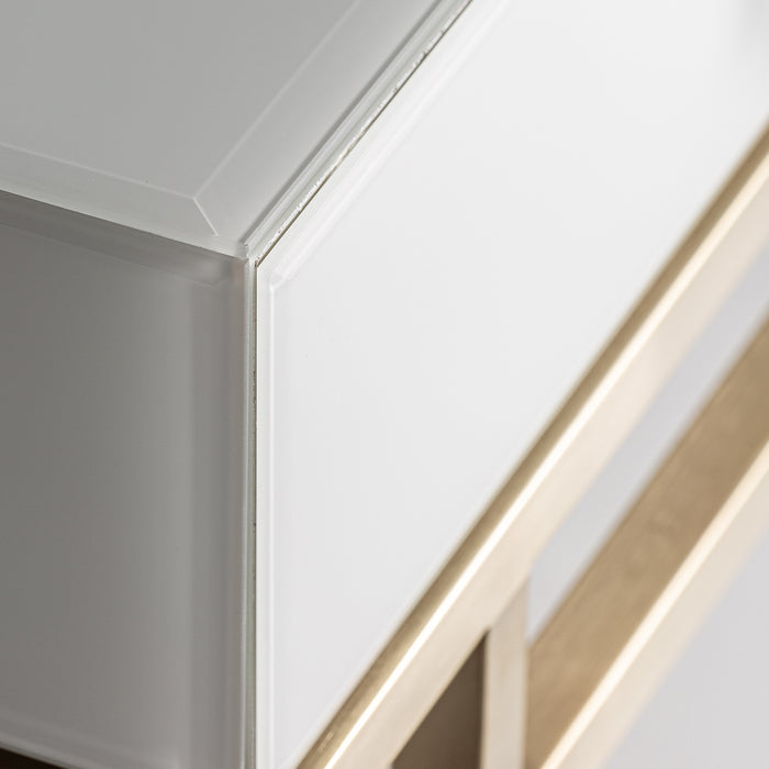 Experience the luxurious elegance of the Hopfing Bedside Table, a masterpiece of Art Deco design. With its captivating White & Gold Matte color, this table adds a touch of sophistication to any bedroom