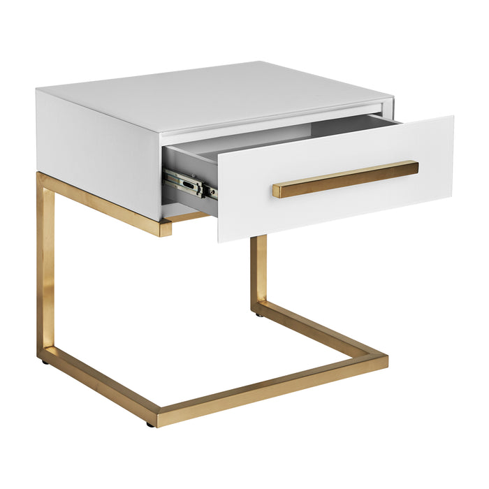 The Nagold Bedside Table in white and matte gold color embodies the timeless elegance of Art Deco style. Crafted from high-quality mirror and steel, it exudes a luxurious and glamorous appeal