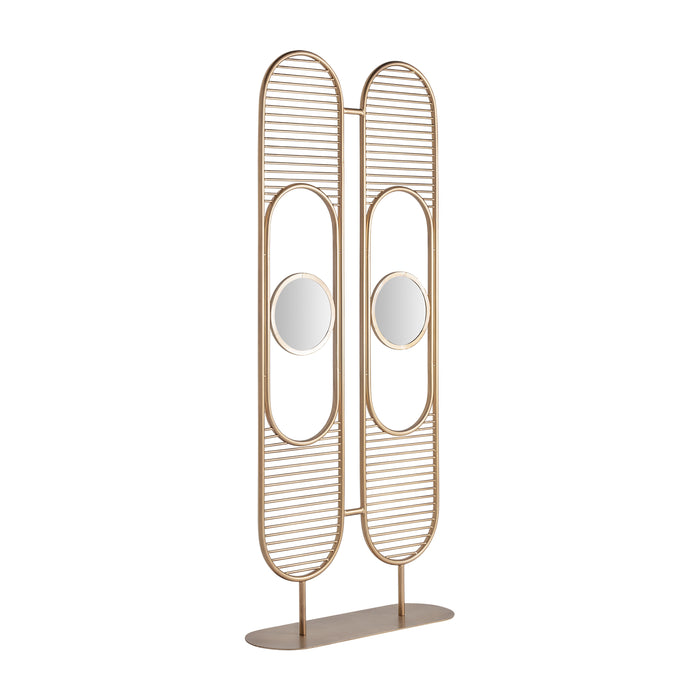 ESPIRA room divider is a durable iron and crystal piece that adds glamour to any room. Its bold gold color and art deco style create a luxurious contrast against lighter-colored walls and furnishings