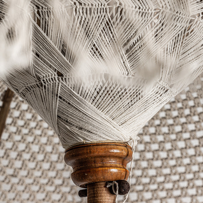 Introducing the artisanal parasol LUKA, a contemporary-style piece that adds a touch of natural elegance to any interior. The parasol is made of high-quality teak wood and combined with cotton, creating a unique and durable piece