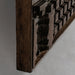 Wall art Kissey, a unique and handmade wall art, inspired by ethnic style. Crafted from high-quality tropical wood in a natural carved color, this piece is both stylish and durable