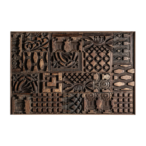 Wall art Kissey, a unique and handmade wall art, inspired by ethnic style. Crafted from high-quality tropical wood in a natural carved color, this piece is both stylish and durable