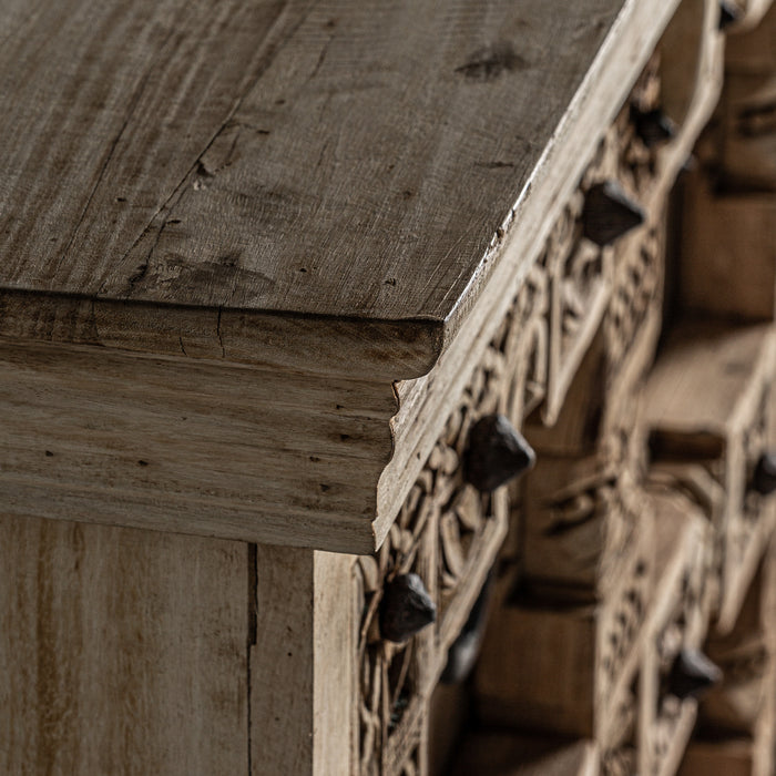 Introducing the exquisite handcrafted Sideboard PHALODI, a stunning piece of natural furniture perfect for any home. The unique ethnic style and natural distressed color create a warm and inviting ambiance