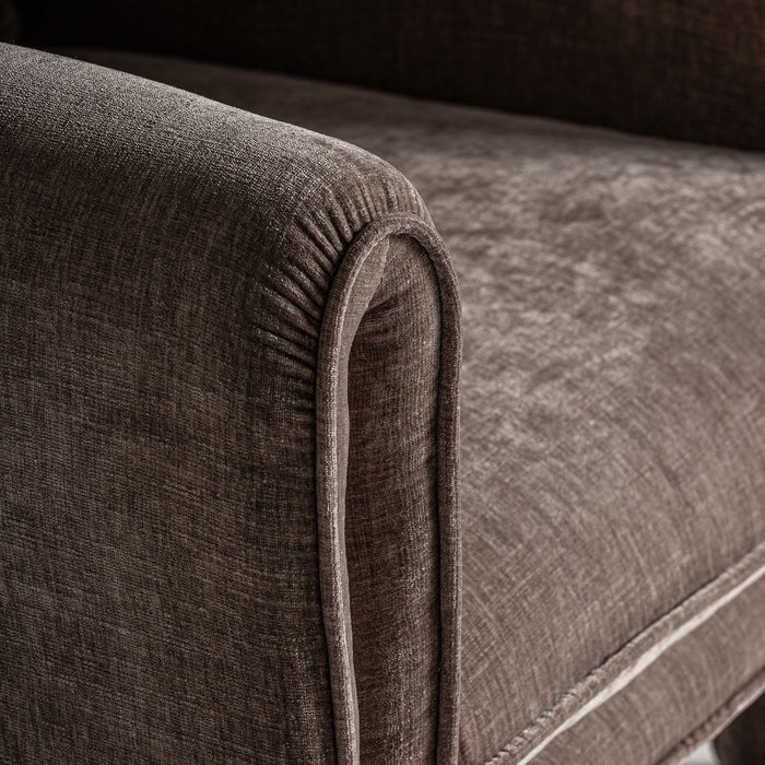 Experience luxurious seating with the ARMCHAIR KARKA. This stunning armchair is upholstered in a timeless taupe fabric and boasts an art deco style for a modern, sophisticated look. Its graceful curves and plush cushioning invite you to relax in opulent comfort.