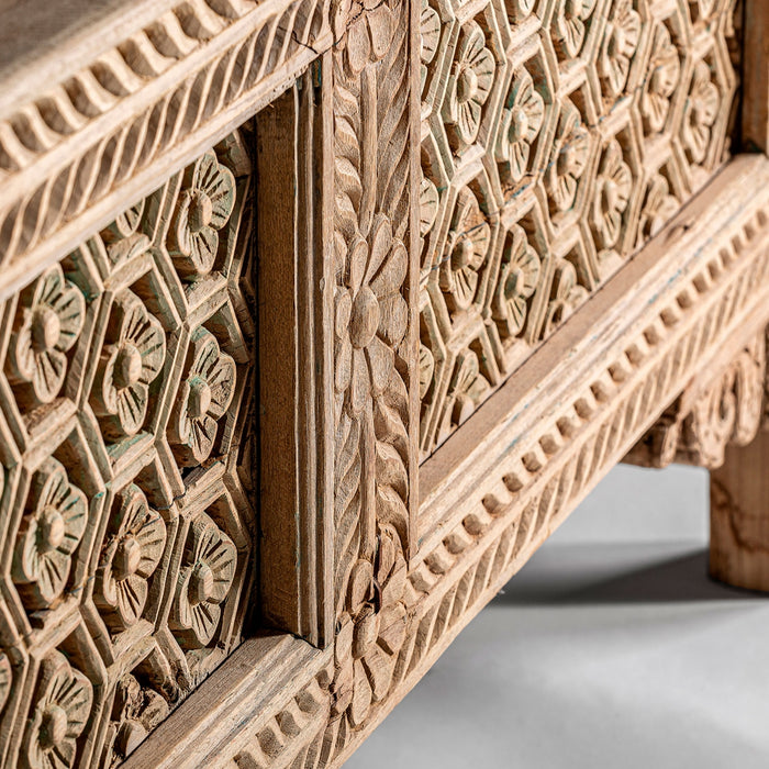 Introduce a touch of ethnic elegance to your living space with the Lakato Console Table. Crafted from high-quality teak wood, this table exudes natural beauty and showcases the artistry of hand-carved details
