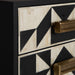 The Senj Bedside Table, crafted from a blend of iron and bone, boasts a striking Art Deco design and is sure to be an eye-catcher with its elegant Black & White color scheme