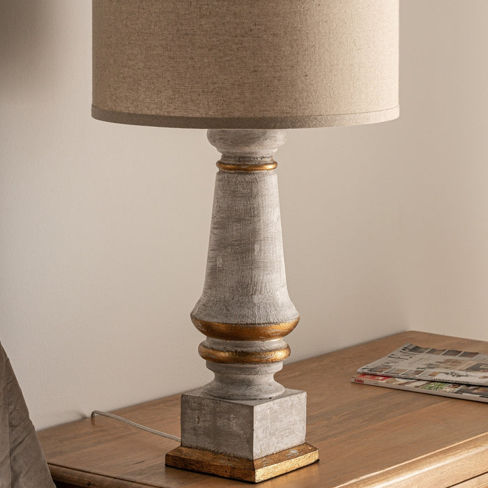 Add a touch of enchanting beauty to your living space with the Crocus Table Lamp. This Provenzal style lamp features a stunning white and gold washed finish that exudes elegance. Crafted from high-quality resin, it is both durable and visually appealing